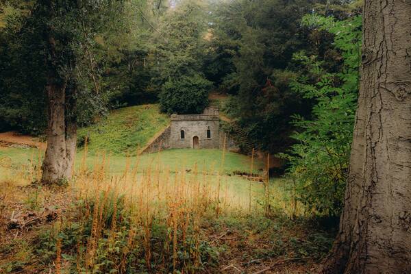 The Georgian cold bath seen through the trees at The Salwey Lodge near Ludlow
