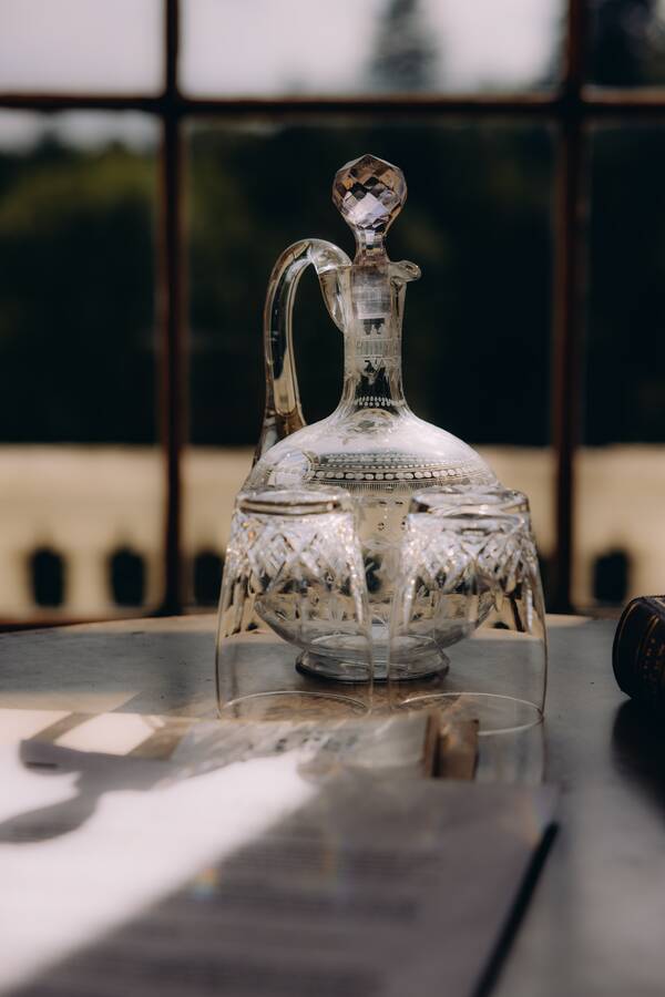 An engraved glass decanter by the window at The Salwey Lodge near Ludlow