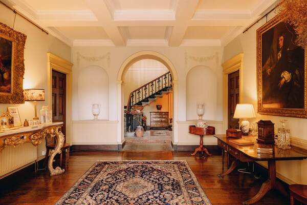 The entrance hall with arched doorway to the Georgian staircase at The Salwey Lodge near Ludlow