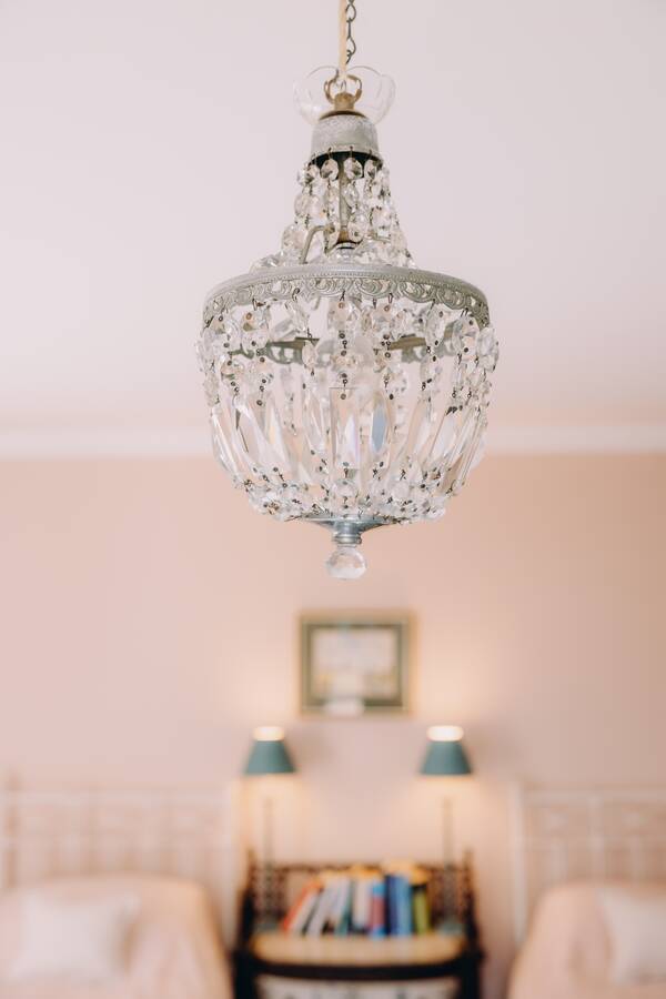 Crystal chandelier in the pink bedroom at The Salwey Lodge near Ludlow